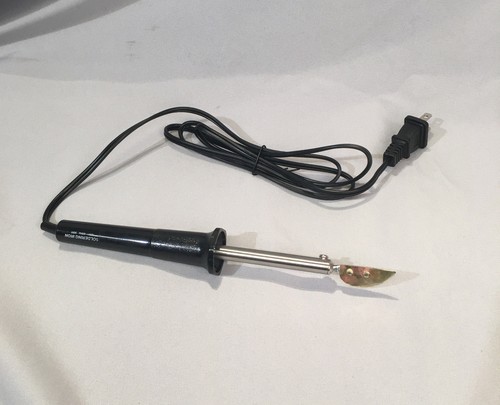 Accordion reed waxing tool.