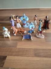 Collection of 11 Disney hard Plastic Aladdin figures