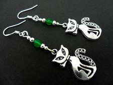 A PAIR OF TIBETAN SILVER/GREEN