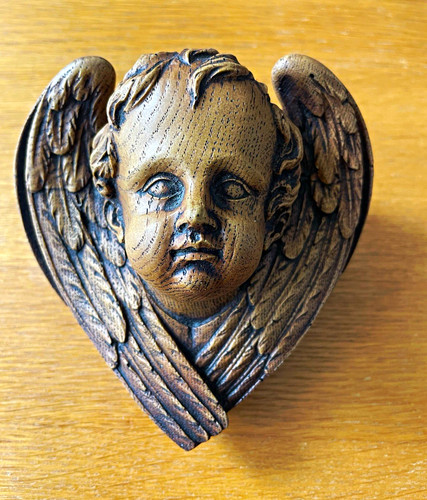 Carved wooden angel - head, with