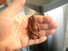 Carved wood netsuke of a