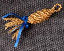 Small traditional handmade Corn Dolly with royal blue ribbon and straw loop