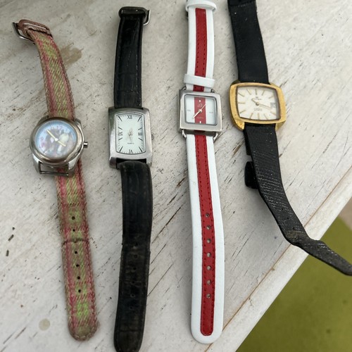 Four wrist watched persona die - four,