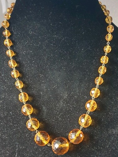 Citrine coloured faceted glass