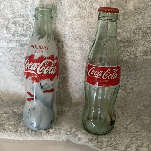 Two old 2005 bottles coca - two,