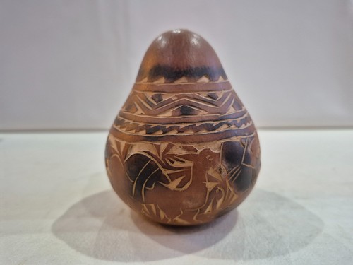 Peruvian hand carved gourd - a,