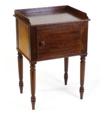 A 19th century  mahogany pot cupboard surmounted by an upstand 