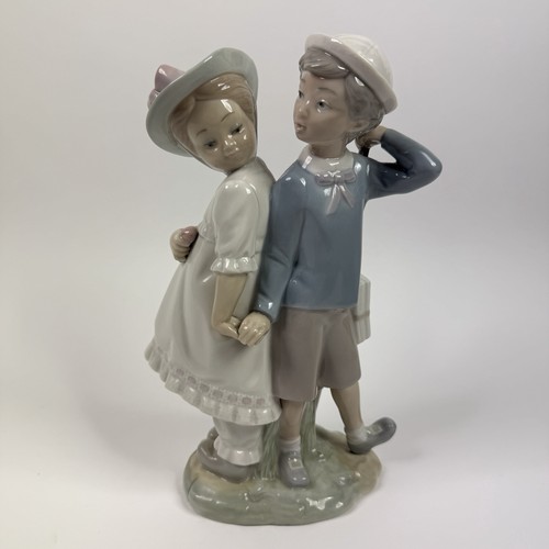 Lladro boy girl holding - boy,