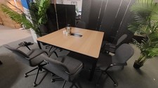 Boardroom office meeting room conference table desk seats six persons