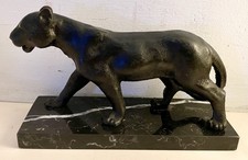 A CAST BRONZE OF A WALKING PANTHER ON A MARBLE BASE AFTER ANTOINE LOUIS BARYE