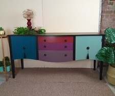 strongbow sideboard hand painted in reds. Greens and black