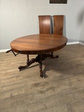 A good Victorian walnut wind out dining table