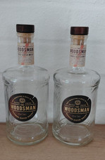 2 Empty Woodsman Whisky