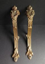 A PAIR OF 19/20TH CENTURY FRENCH  EMPIRE GILT BRASS CURTAIN POLE HOLDERS