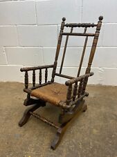 ANTIQUE 19th CENTURY TURNED SPINDLE BOBBIN CHILDS ROCKING CHAIR WITH RUSH SEAT