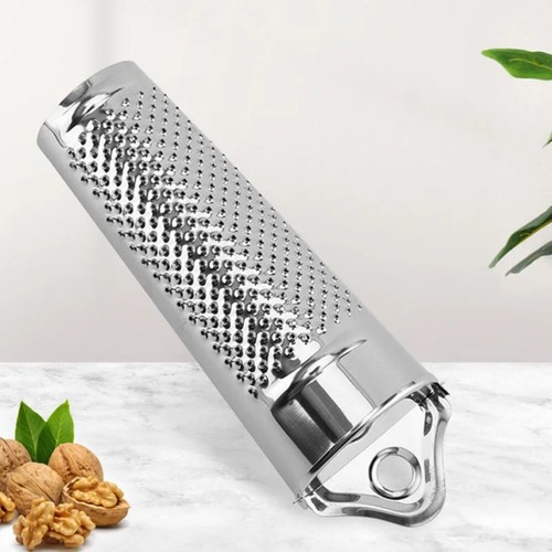 Hand held nutmeg grater - hand,