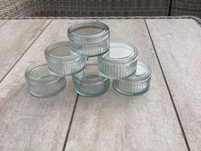 Six Fluted Glass Ramekins with sealed lids.