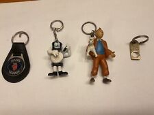 Collection of 4 Vintage Keyrings … Tintin Keyring , Saab Scania , Energizer 