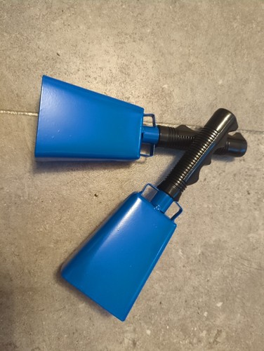 Pair handheld cowbells - of,