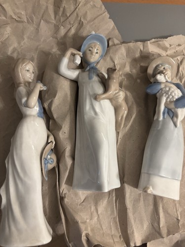 Three rex valencia figurines - three,