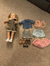 Our Generation Doll with additional outfits 