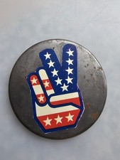 A Vintage Peace Sign depicted as a hand making the "V" gesture Tin Badge