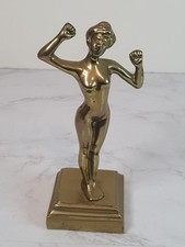 Brass Naked Woman Posing