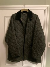 John Partridge Medium Green Quilted jacket dark green pocket detail + pin badge