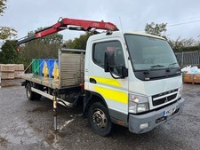 2012 Mitsubishi FUSO Canter 7.5t flatbed lorry FASSI F50 Crane