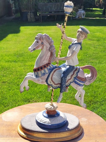 Lladro boy on carousel - lladro,