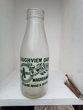 Vintage milk bottles, R .WILSON