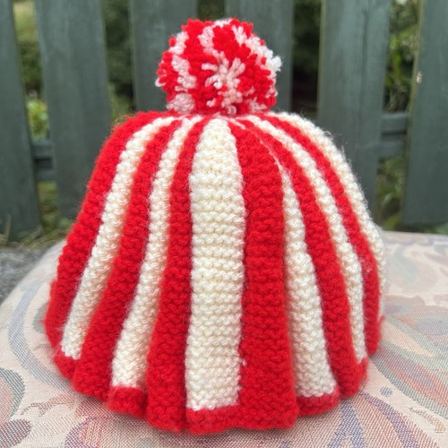 Hand knitted red cream - hand,