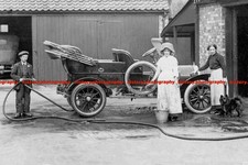 F004611 Britain Two women and a child wash the Napier car 1910