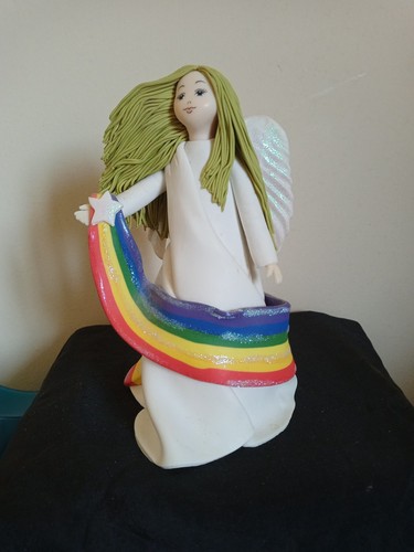 Angel statue with rainbow - with,