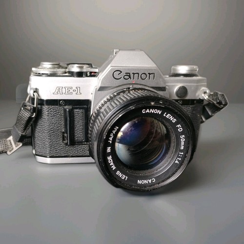 Canon slr film camera - ae-1, +
