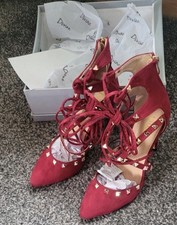 Red suede lace up heels with