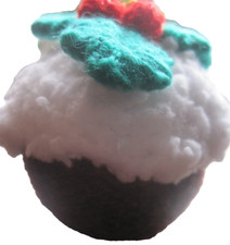 A HAND KNITTED XMAS PUDDING