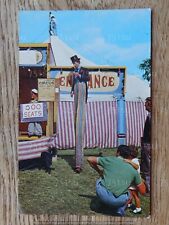 Cody's Circus performers. Man on stilts at the Fairground