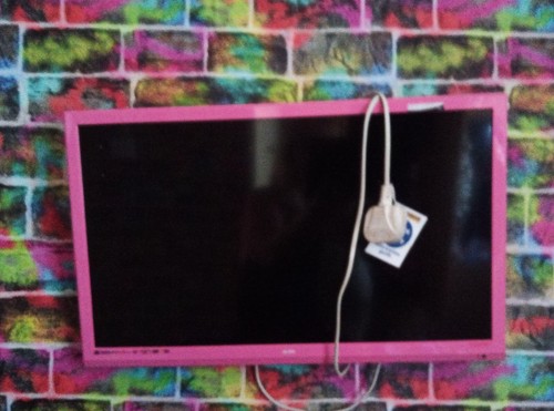 Pink with remote and - tv,