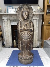 A hand-carved wooden standing