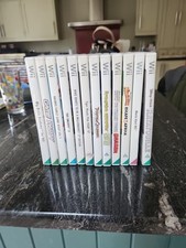 Nintendo WII 12x Games Bundle Plus Mario Kart Wheel Plus Wii Controller