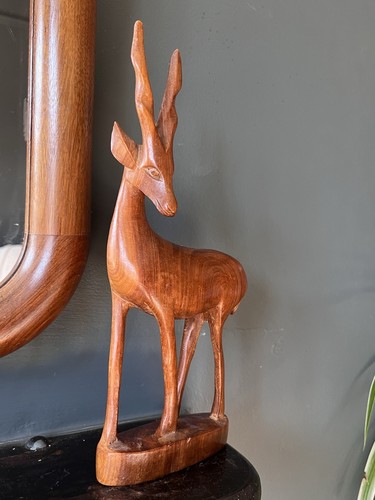 Hand carved wooden deer - hand,