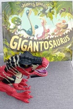 T-Rex Dinosaur Toy With Light Up Eyes And Roar and Gigantosaurus book
