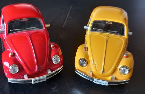 Two volkswagen beetle die - two,