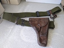 VINTAGE GREEN MILITARY WEBBING STYLE BELT AND LEATHER GUN HOLSTER
