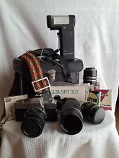 Minolta SRT 303 camera complete with lenses, flash, filter and case