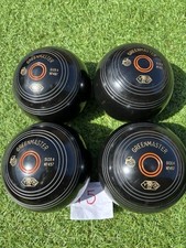 SIZE 4 , GREAT CONDITION **PRICE ** GREEN MASTER LAWN BOWLS ,plus carrier