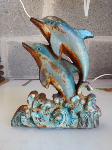 Cast metal dolphins jumping - cast,