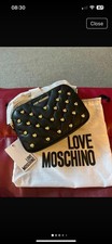 Love Moschino black quilted crossbody bag with gold heart studs. New & tags