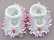 Hand knitted dolls clothes